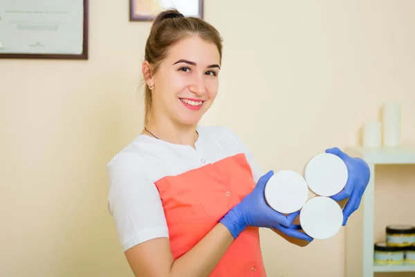 Young Woman Medical Coat Blue Rubber Gloves Holds Her Hands — Stock Photo, Image