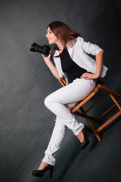 Attractive Girl Photographer Sits Chair Camera Her Hands Studio Gray — Stock Photo, Image