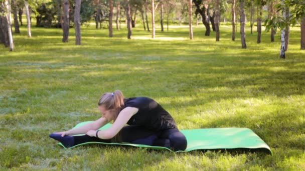 Outdoor Pilates Training Young Woman Stretches Her Leg Sitting Yoga — Stock Video