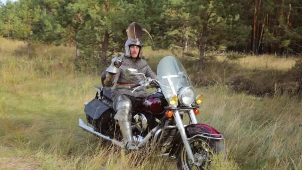 Medieval Knight Full Armor Sits Motorcycle Backdrop Forest — Stock Video