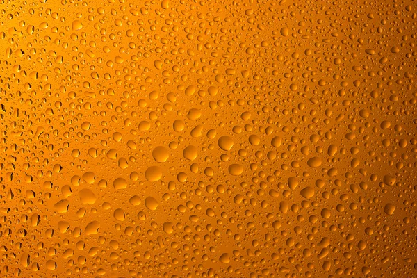 Yellow drops on glass — Stock Photo, Image