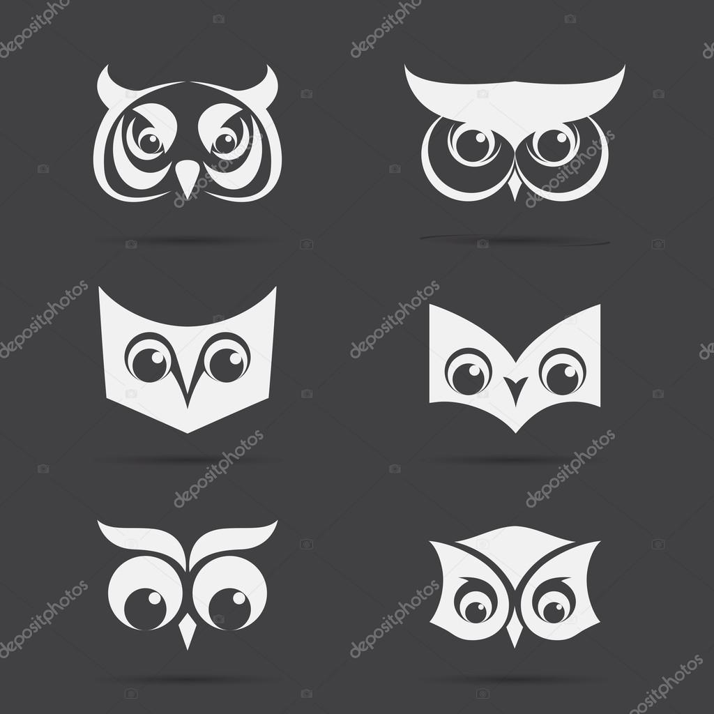 Vector image of an owl face design on black background. Vector owl face for your design.