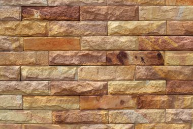Sand stone wall surface, background of decorate - wallpaper clipart