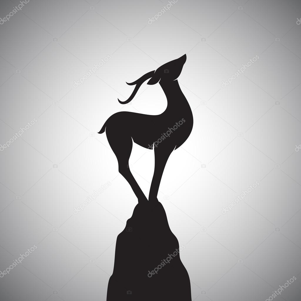 Vector image of a deer standing on the rocks.