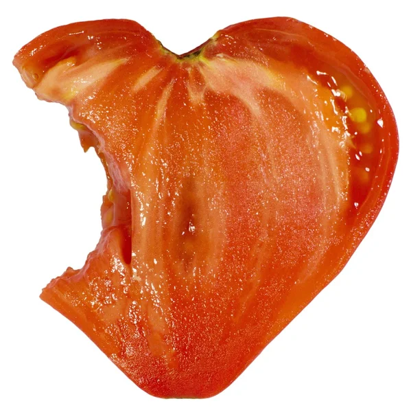 Angebissene herzförmige Tomate — Stockfoto