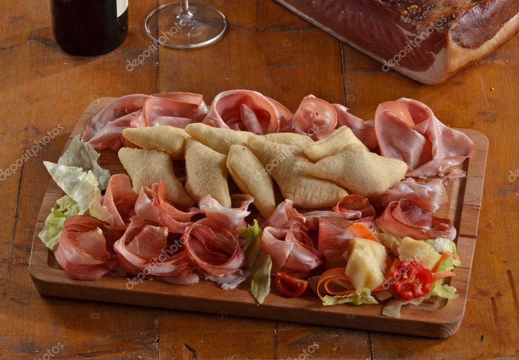 Mixed sliced prosciutto salami — Stock Photo © gosphotodesign 100265004