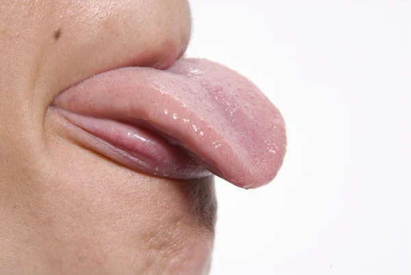 Sick Young woman showing her tongue — Stock Photo, Image