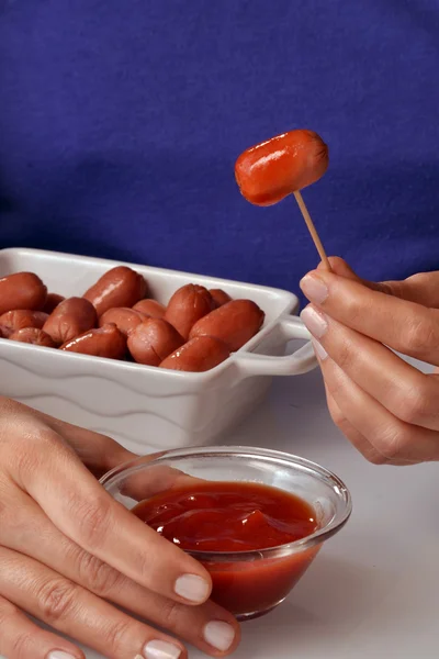 Woman Picking mini sausage — Stock Photo, Image