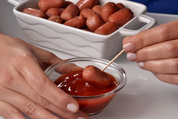 Woman Picking mini sausage — Stock Photo, Image