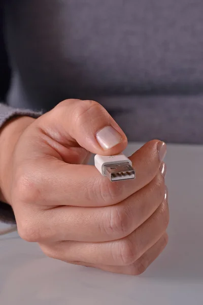 Woman holding USB cable — Stock Photo, Image