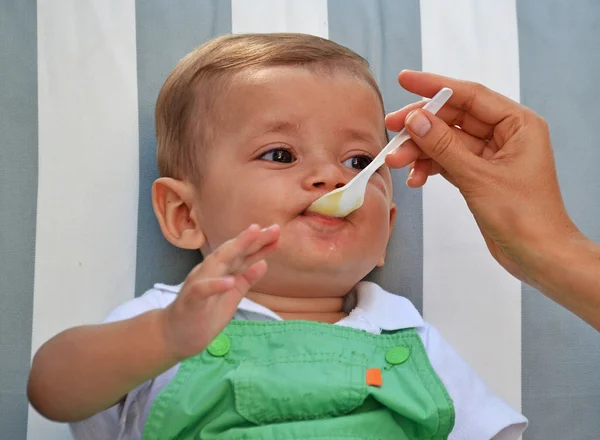 Little baby boy eating — Stock Photo, Image