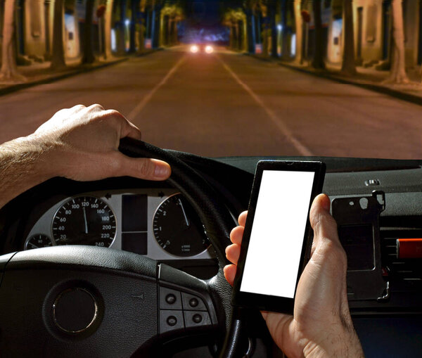 Car driver using cell phone while driving.