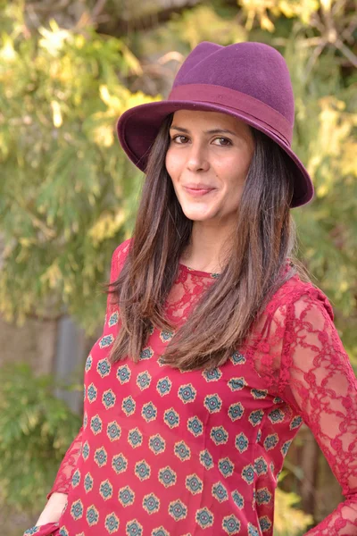 Woman wearing red shirt and cap. — Stock Photo, Image