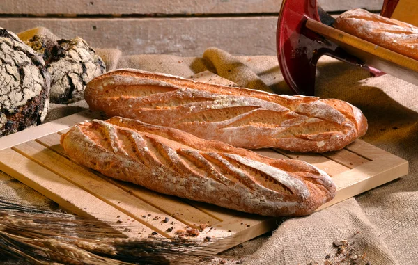 Rustic bread and wheat — Stock Photo, Image