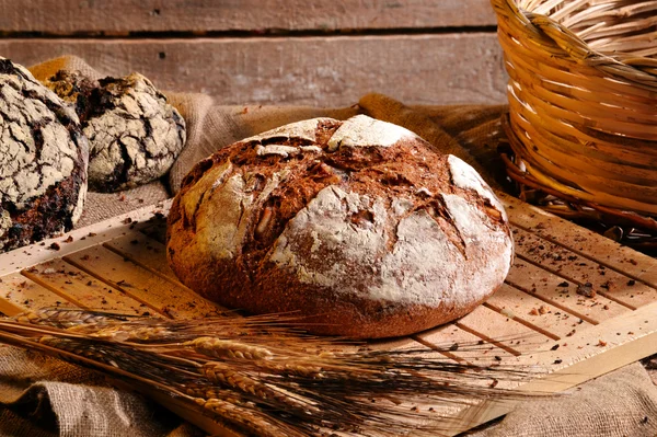 Rustic bread and wheat — Stock Photo, Image