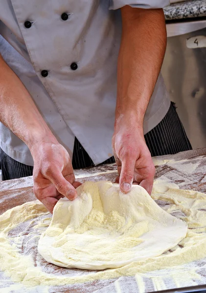 Cook preparing pizza dough. — Stock Photo, Image