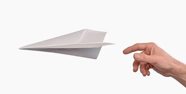 Ręka rzucanie papierowy samolot — Zdjęcie stockowe
