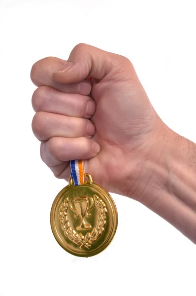 Ruka držící zlatou medaili — Stock fotografie