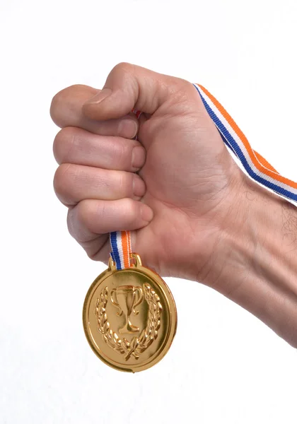 Ruka držící zlatou medaili — Stock fotografie