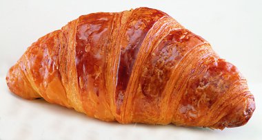 One croissant on white