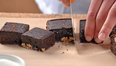 Pastry chef hands preparing brownies