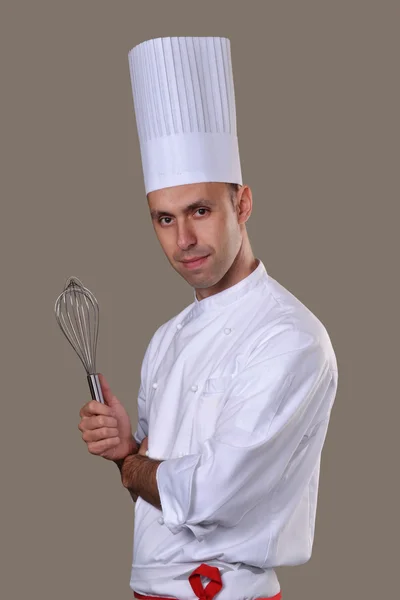 Cook holding a mixer. — Stock Photo, Image