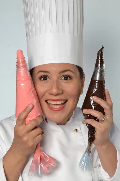 Woman cook holding  cones — Stock Photo, Image