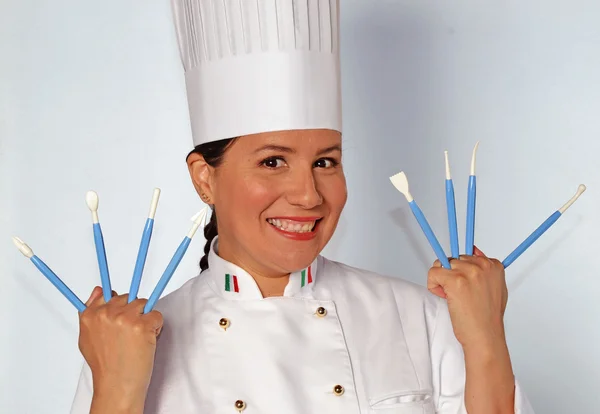 Woman holding cook utensils — Stock Photo, Image