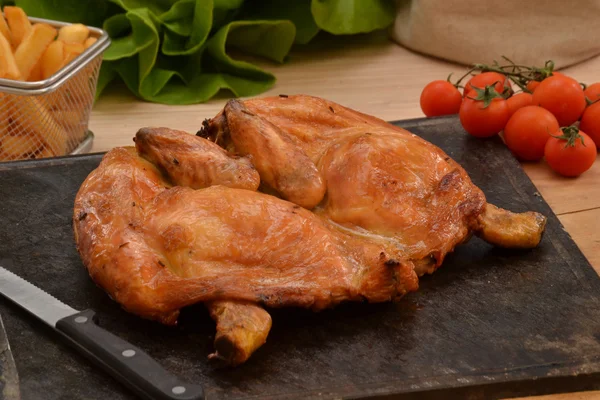 Grilled chicken on hot grill stone — Stock Photo, Image