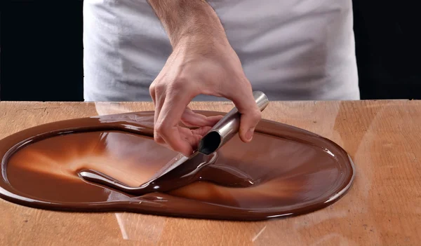 Cook mixing chocolate cream — Stock Photo, Image