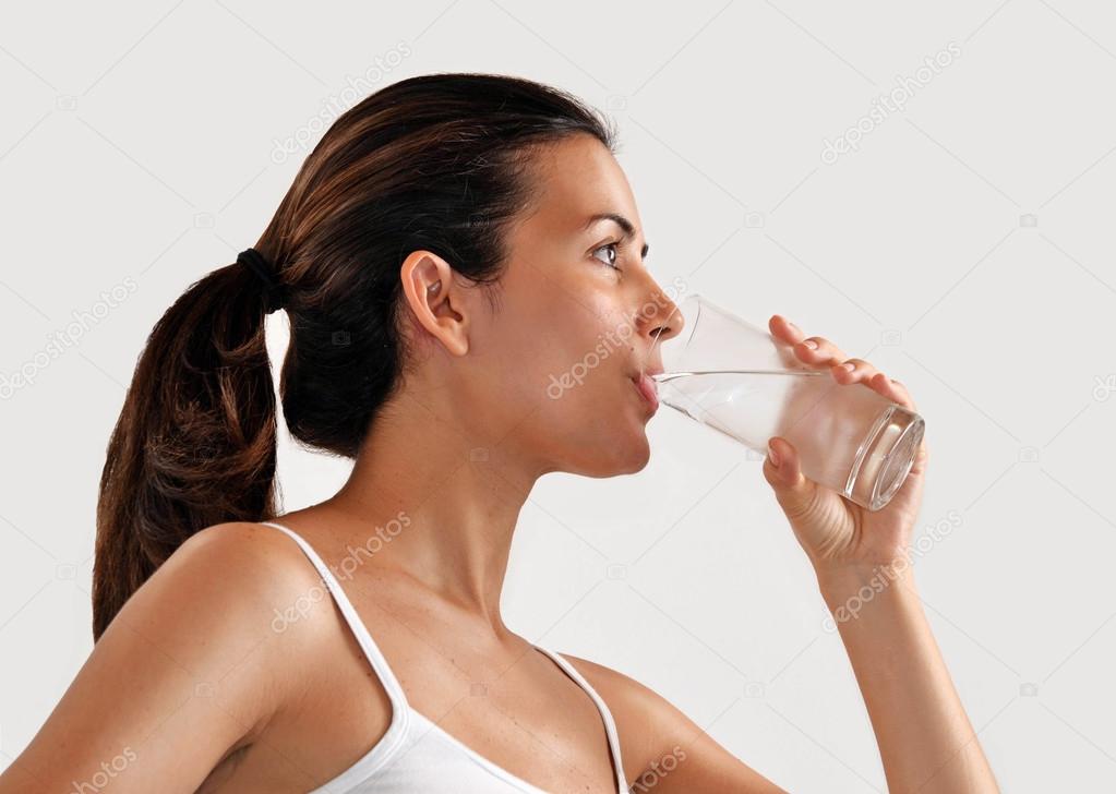 woman drinking mineral water glass.