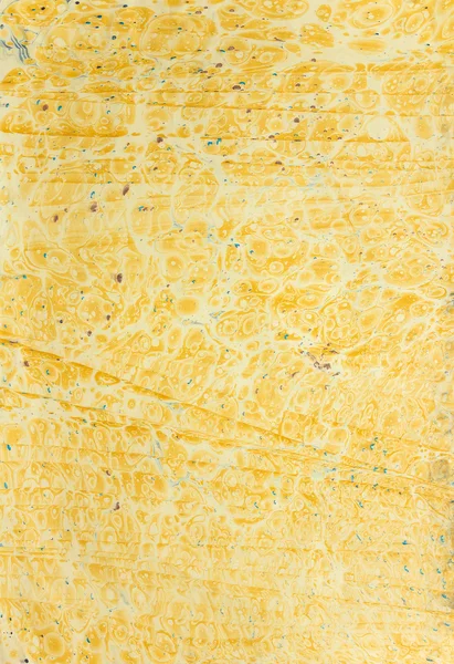 Желтый эбру с пузырями и линиями — стоковое фото