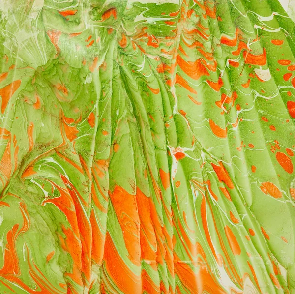 Оранжевый и зеленый эбру — стоковое фото