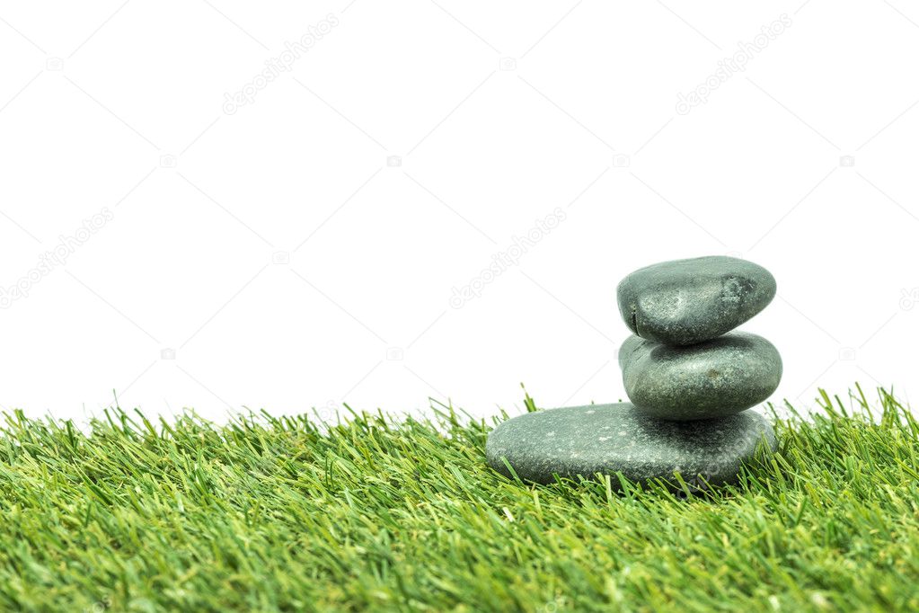 Stone with green grass