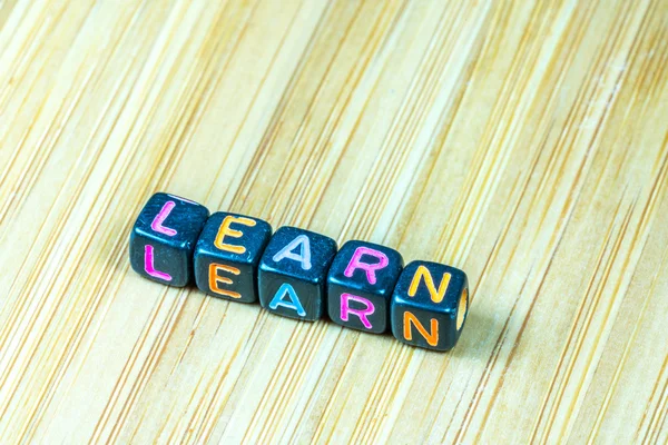 Colorful Letter Cube Bamboo Texture Surface Educational Stock Photo