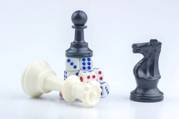 White dice and chess piece — Stock Photo, Image