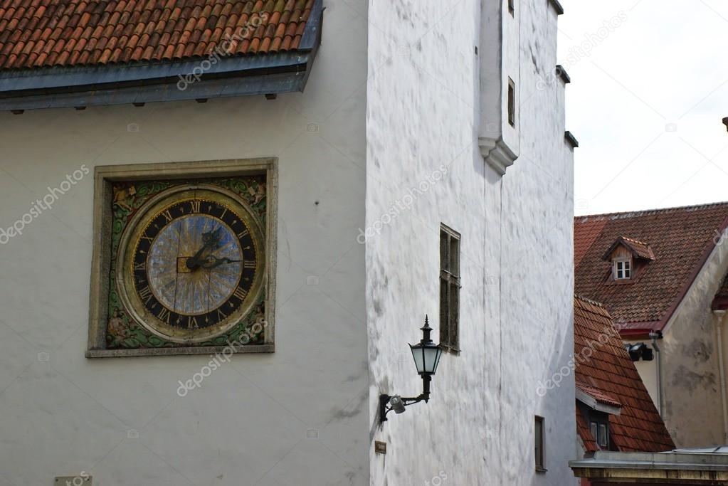 Clock at the walls of church in Tallinn — Stock Photo © Ribtoks 82117176