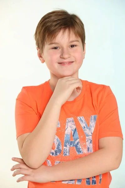 Portrait Handsome Developed Cheerful Teenage Boy Orange Shirt Smiles Happily — Stock Photo, Image
