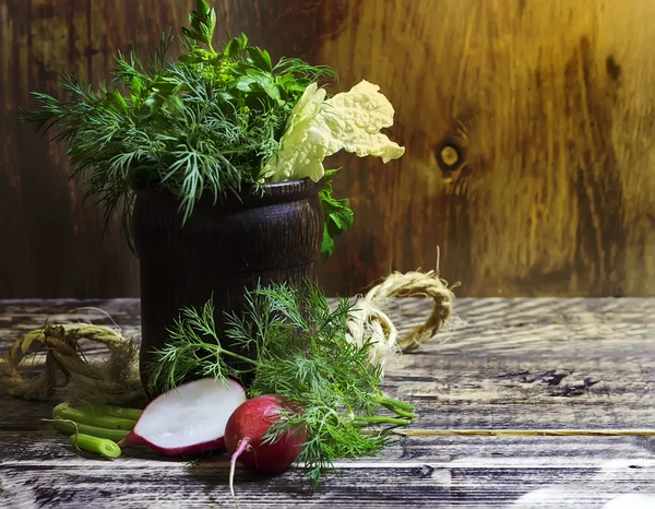 Bouquet of fragrant herbs of fennel and parsley, on a wooden background, rural style, selective focus    design, effects, toning