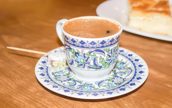 Cup of the Turkish coffee on a wooden table