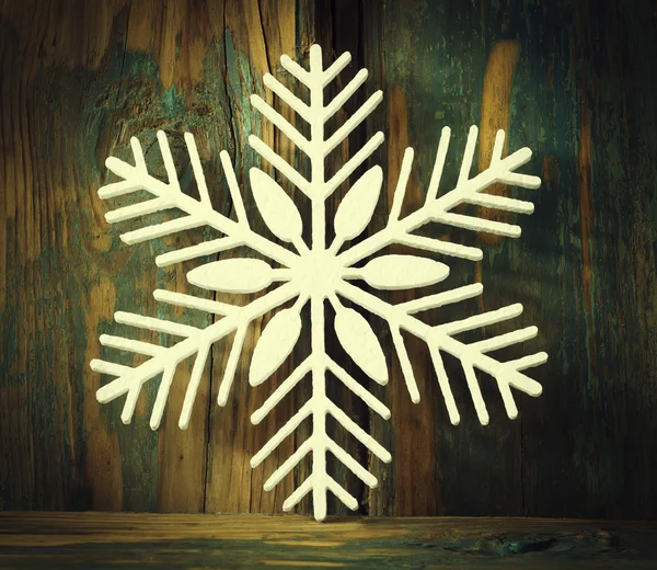 Snowflakes from polyfoam  on wooden texture — Stock Photo, Image