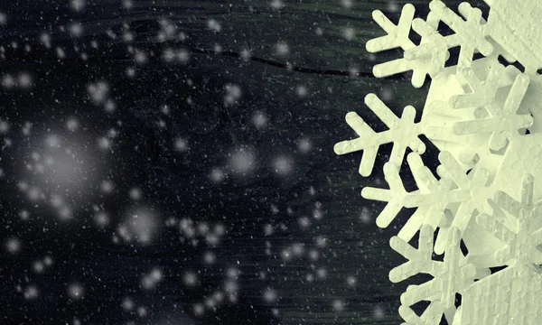 Snowflakes from polyfoam on wooden texture — Stock Photo, Image