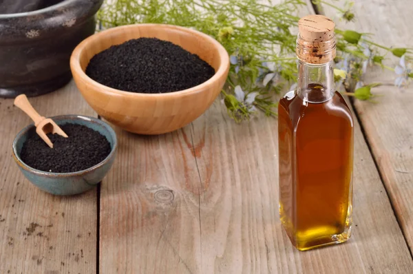 Nigella sativa oil. — Stock Photo, Image