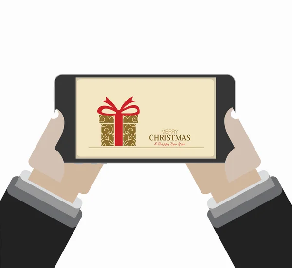 画面にクリスマスの挨拶のカード。手はそれを保持しています。. — ストックベクタ