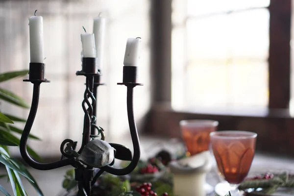 Forged metal candlestick with candles — Stock Photo, Image