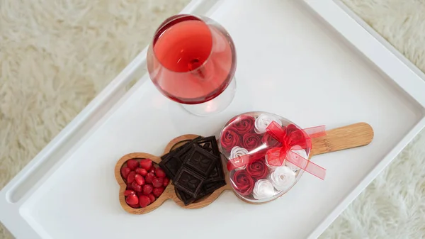 Breakfast for girlfriend. Valentines Day Morning. Wine and sweets on white tray — Stock Photo, Image