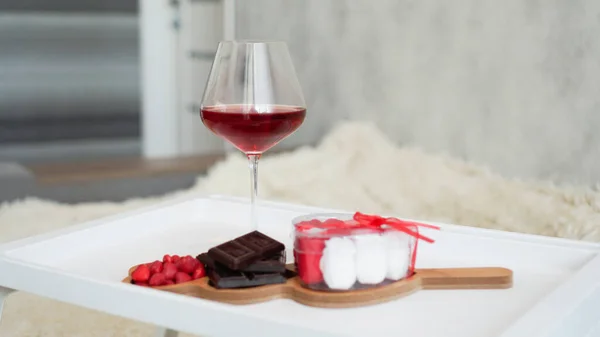 Breakfast for girlfriend. Valentines Day Morning. Wine and sweets on white tray — Stock Photo, Image