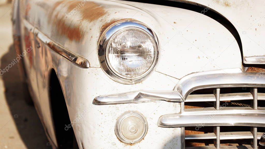 Retro car. Old vintage car. Headlight close up. Exhibition of retro cars