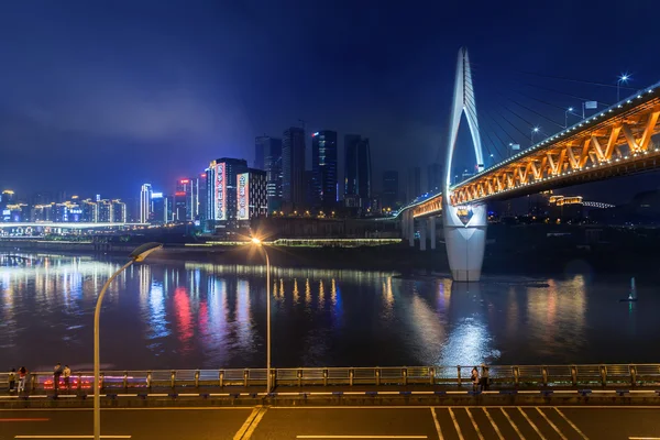 China cityscape at the Jialing River and Qianximen Bridge.