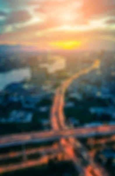 Borrão de vista do pôr do sol da ponte e da cidade — Fotografia de Stock